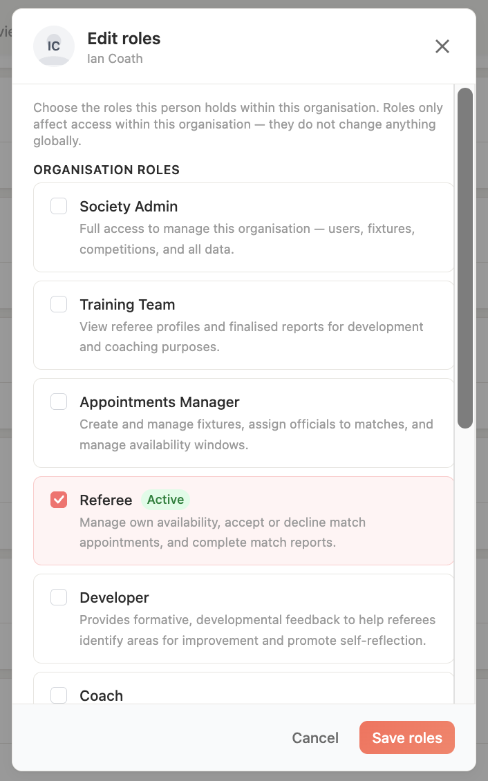 The role assignment UI showing a member's roles being edited